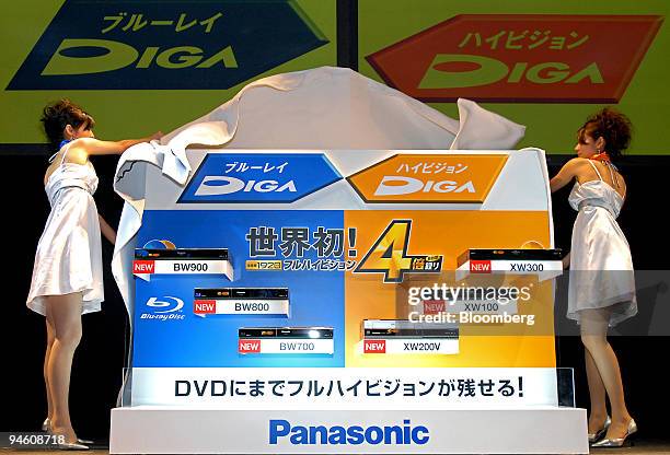 Models unveil Matsushita Electric Industrial Co.'s new series of Panasonic DIGA blu-ray disc and high-definition DVD recorders at the Combined...