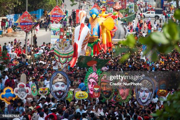 Clad in colourful attires thousands of people and students of the Faculty of Fine Arts of Dhaka University take part in the traditional Mongol...