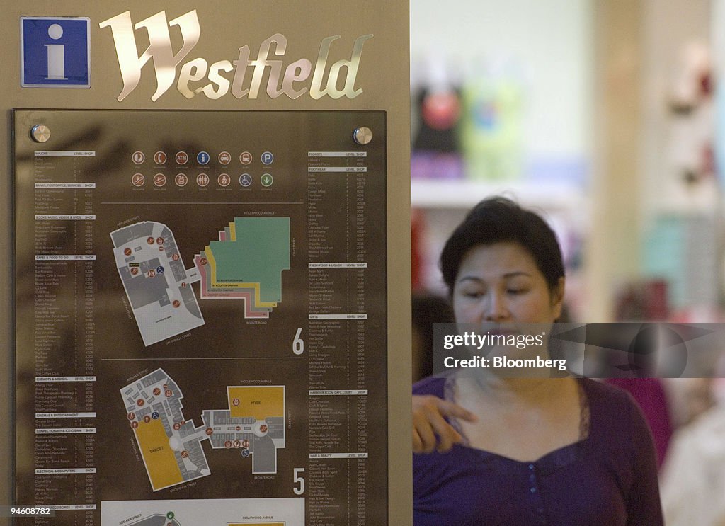 A shopper looks at an information board inside a Westfield G