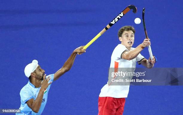 Harry Martin of England and Mandeep Singh of India compete for the ball during the Men's Bronze Medal match between England and India during the...