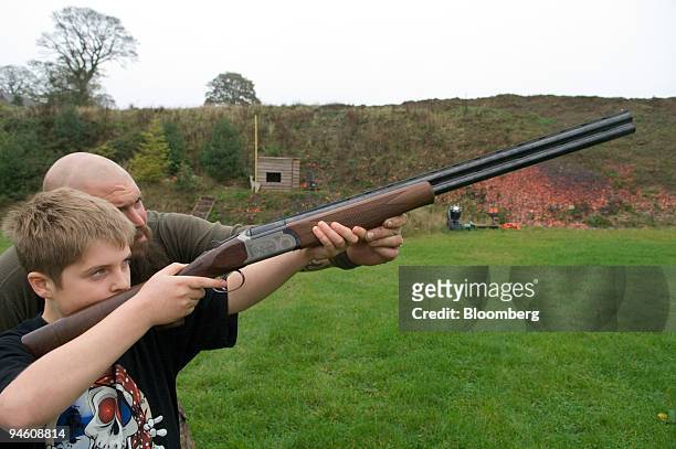 Phil Lynch, gamekeeper, deerstalker and shooting instructor at Minsterley Ranges, teaches Hugh Smith how to use a shotgun for clay pigeon shooting in...