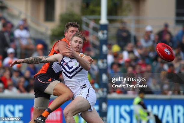 Cam McCarthy of the Dockers has his mark attempt spoiled during the round four AFL match between the Greater Western Sydney Giants and the Fremantle...