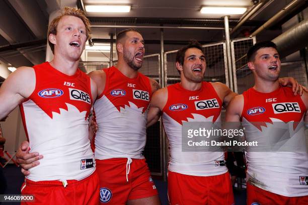 Swans players sing the team song after winning the round four AFL match between the Western Bulldogs and the Sydney Swans at Etihad Stadium on April...