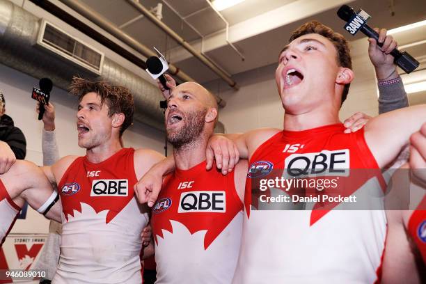 Swans players sing the team song after winning the round four AFL match between the Western Bulldogs and the Sydney Swans at Etihad Stadium on April...