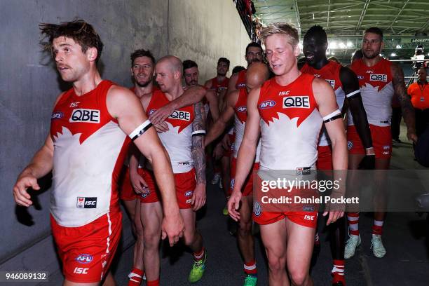 Swans players leave the ground after winning the round four AFL match between the Western Bulldogs and the Sydney Swans at Etihad Stadium on April...