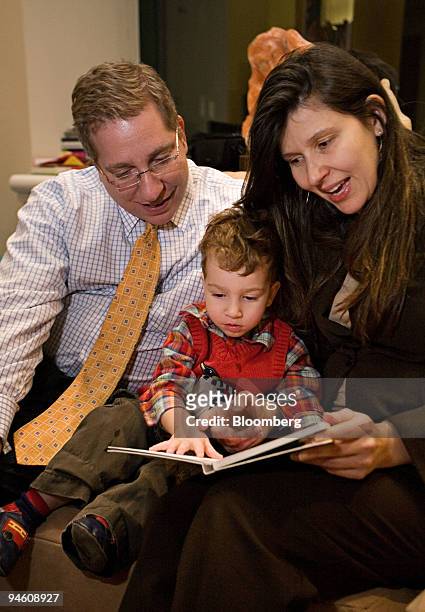 Sofia Mata and her husband Michael Bruder read to their son Rafael Bruder at their home in New York, March 6, 2007. Michael Bruder feared his...