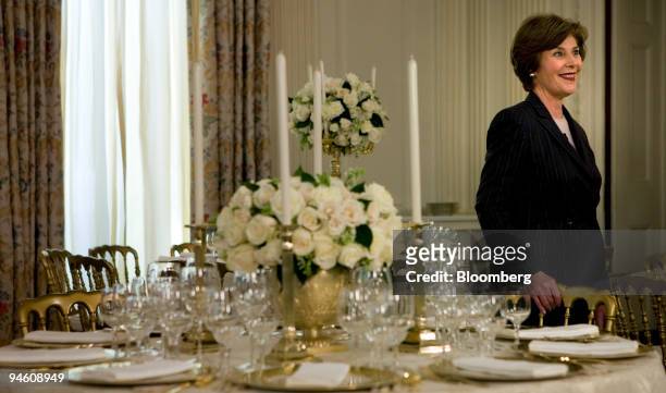 First Lady Laura Bush stands near a table in the State Dining Room of the White House May 7 in Washington, D.C. The First Lady previewed the place...