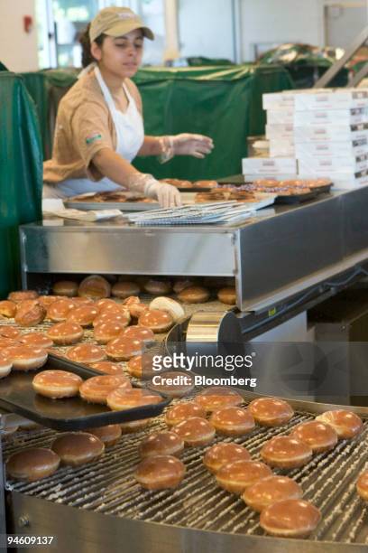 Priscilla Araujo prepares to fill boxes with doughnuts at a Krispy Kreme store in Dedham, Massachusetts Tuesday, June 13, 2006. Krispy Kreme...