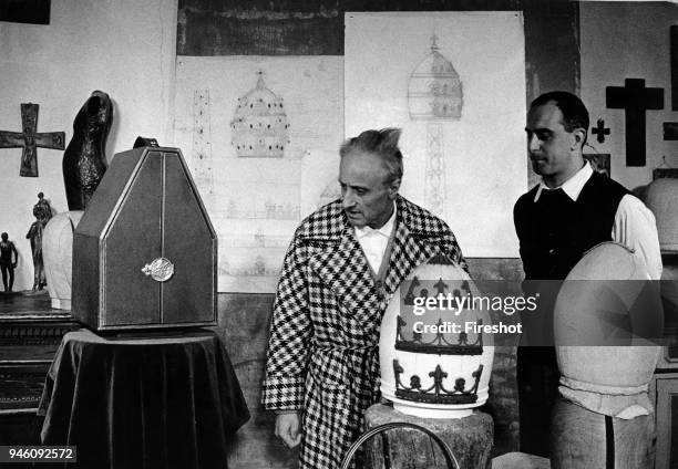 Bergamo April 1959 The sculptor Attilio Nani with her sons workin on the tiara that the provincial government will offer to Pope John XXIII May 2,...