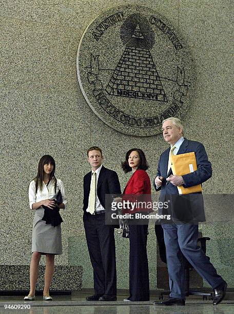 Former Hollinger International Chief Executive Officer Conrad Black, right, enters the Dirksen Federal Building for testimony in his Federal...