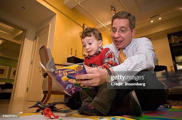 Michael Bruder reads "The Pied Piper of Hamelin" in Portuguese to his son Rafael Bruder at their home in New York, March 6, 2007. Michael Bruder...