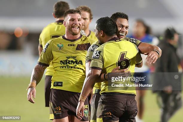 Broncos team mates celebrate after the round six NRL match between the New Zealand Warriors and the Brisbane Broncos at Mt Smart Stadium on April 14,...
