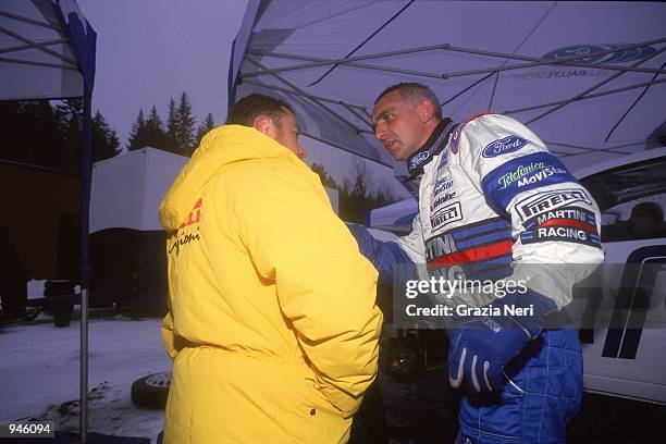 Francois Delecour of France driving the Ford Focus with a Pirelli Tyre Technician during the World Rally Championship Swedish Rally around Karlstad...