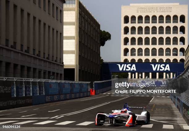 Mahindra racing team Formula E driver, Sweden's Felix Rosenqvist steers his car past the Palazzo della Civilta Italiana during practice prior to the...
