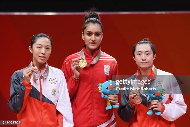 Silver medalist Mengyu Yu of Singapore, gold medalist Manika Batra of India and bronze medalistÊTianwei Feng of Singapore pose during the medal...