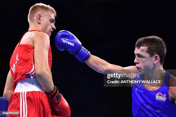 Northern Ireland's Kurt Walker fights England's Peter McGrail during their men's 56kg final boxing match during the 2018 Gold Coast Commonwealth...
