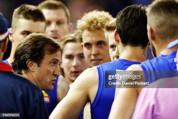 Bulldogs head coach Luke Beveridge talks to his team during the round four AFL match between the Western Bulldogs and the Sydney Swans at Etihad...