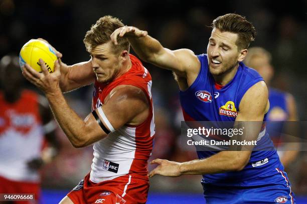 Luke Parker of the Swans and Marcus Bontempelli of the Bulldogs contest the ball during the round four AFL match between the Western Bulldogs and the...