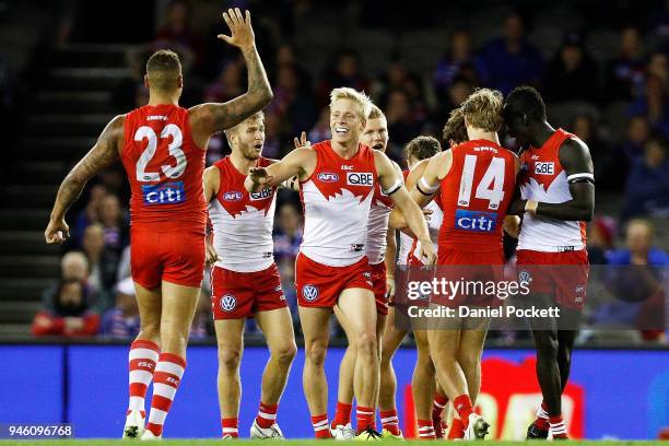 Swans players celebrate after winning the round four AFL match between the Western Bulldogs and the Sydney Swans at Etihad Stadium on April 14, 2018...