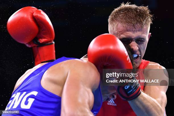 Northern Ireland's Kurt Walker fights England's Peter McGrail during their men's 56kg final boxing match during the 2018 Gold Coast Commonwealth...