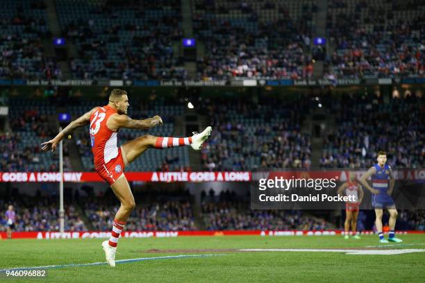 Lance Franklin of the Swans kicks for goal during the round four AFL match between the Western Bulldogs and the Sydney Swans at Etihad Stadium on...