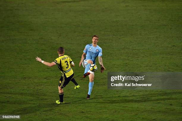 Luke Brattan of Melbourne City controls the ball from Scott Galloway of the Phoenix during the round 27 A-League match between the Wellington Phoenix...