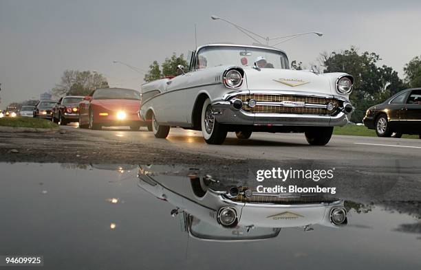 Jim and Carol Andrikides of Northville, Michigan, cruise along in their 1957 Chevrolet Bel-Air during the 12th Annual Woodward Dream Cruise in Royal...