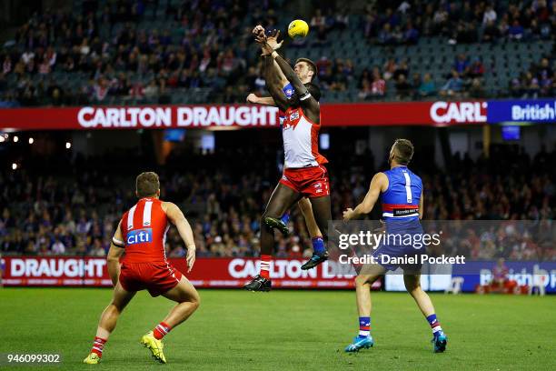 Bailey Williams of the Bulldogs and Aliir Aliir of the Swans during the round four AFL match between the Western Bulldogs and the Sydney Swans at...