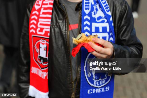 Fan holding some match food is seen prior to the Premier League match between Southampton and Chelsea at St Mary's Stadium on April 14, 2018 in...