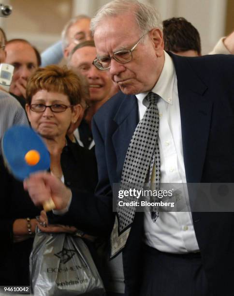 Berkshire Hathaway Inc. Chairman Warren Buffett plays table tennis against Ariel Hsing as part of an event for the Berkshire Hathaway annual meeting,...