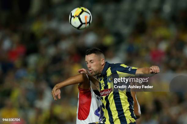 Blake Powell of the Mariners contests the header during the round 27 A-League match between the Central Coast Mariners and the Newcastle Jets at...