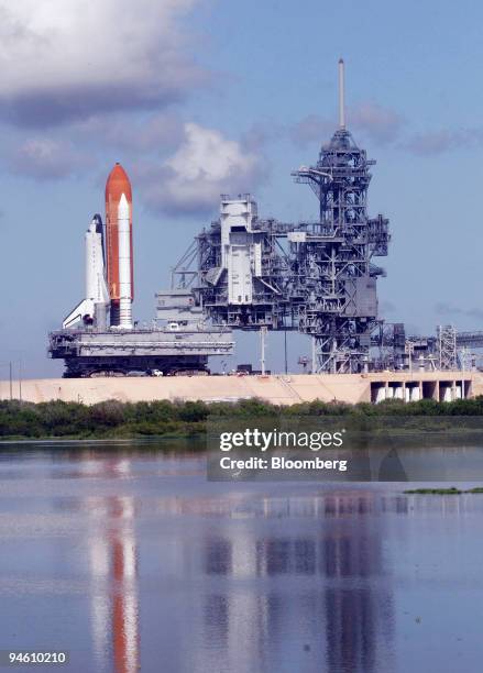 Space Shuttle Atlantis is pulled away from the launch pad at NASA headquarters at Kennedy Space Center in Cape Canaveral, Florida, on Tuesday, August...