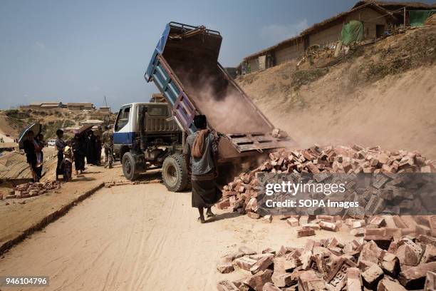 Brick roads are built through Kutupalong in preparation for the Monsoon season. There are now approximately 600,000 Rohingya refugees in the...