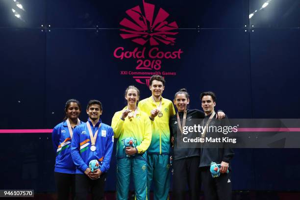 Gold medallists Donna Urquhart and Cameron Pilley of Australia, silver medallists Joelle King and Paul Coll of New Zealand and bronze medallists...