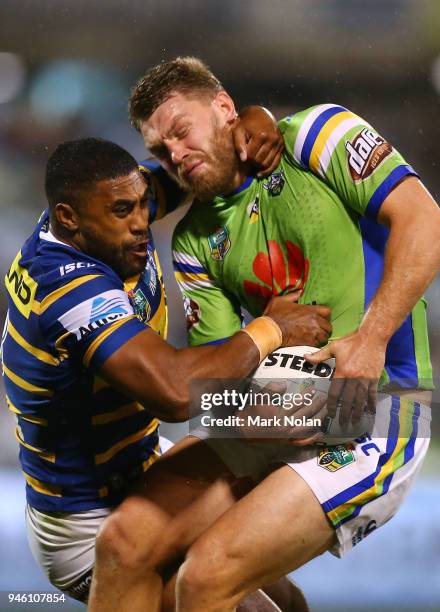 Michael Jennings of the Eels tackles Elliot Whitehead of the Raiders high during the round six NRL match between the Canberra Raiders and the...