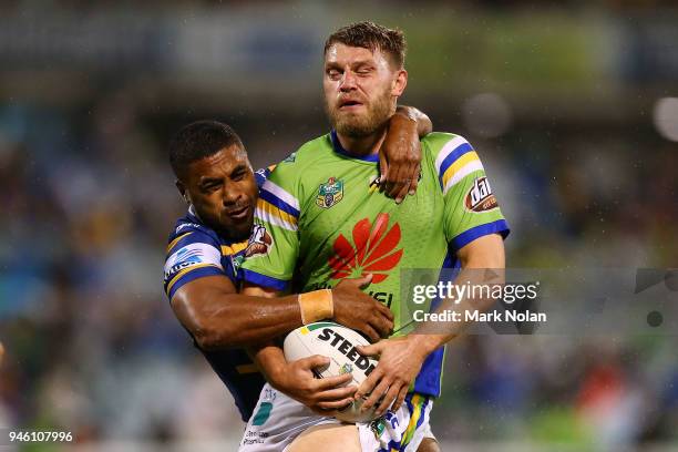 Michael Jennings of the Eels tackles Elliot Whitehead of the Raiders high during the round six NRL match between the Canberra Raiders and the...