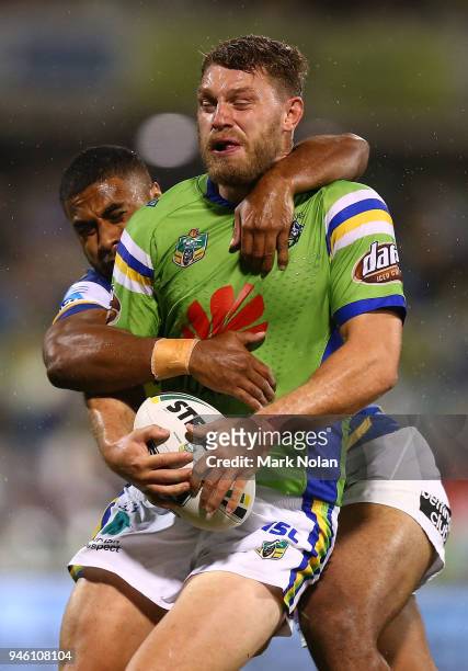 Michael Jennings of the Eels tackles Elliot Whitehead of the Raiders high during the round six NRL match between the Canberra Raiders and the...