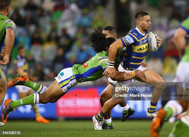 Corey Norman of the Eels is tackled during the round six NRL match between the Canberra Raiders and the Parramatta Eels at GIO Stadium on April 14,...