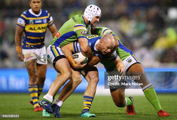 Beau Scott of the Eels is tackled during the round six NRL match between the Canberra Raiders and the Parramatta Eels at GIO Stadium on April 14,...