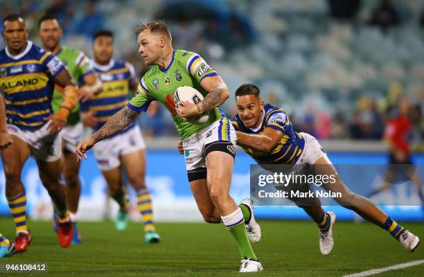 Blake Austin of the Raiders is tackled during the round six NRL match between the Canberra Raiders and the Parramatta Eels at GIO Stadium on April...