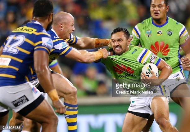 Jordan Rapana of the Raiders is tackled during the round six NRL match between the Canberra Raiders and the Parramatta Eels at GIO Stadium on April...