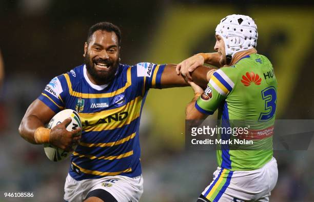 Tony Williams of the Eels plams off Jarrod Croker of the Raiders during the round six NRL match between the Canberra Raiders and the Parramatta Eels...