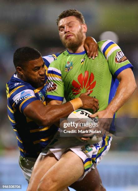 Michael Jennings of the Eels tackles Elliot Whitehead of the Raiders high during the round six NRL match between the Canberra Raiders and the...