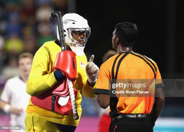 George Pinner of England argues with the referee in the Men's bronze medal match between England and India during Hockey on day 10 of the Gold Coast...