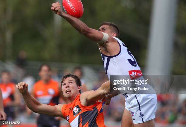 Toby Greene of the Giants contests the ball during the round four AFL match between the Greater Western Sydney Giants and the Fremantle Dockers at...