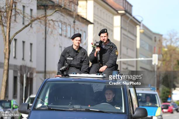 Riot police with a rose. Some hundreds of people joined the March for Science in Munich, Germany, on 14 April 2018. Among them there was the Pirate...
