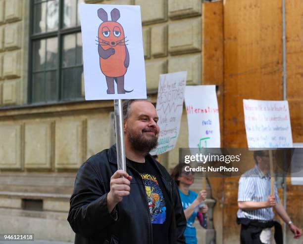 Man with the 'Maus' of the TV-show 'Sendung mit der Maus'. Some hundreds of people joined the March for Science in Munich, Germany, on 14 April 2018....