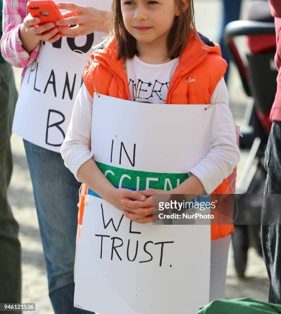 Girl with a sign saying 'in SCIENCE we trust'. Some hundreds of people joined the March for Science in Munich, Germany, on 14 April 2018. Among them...