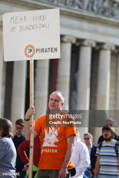 An activist of the pirate party asking for more brain in the Bundestag. Some hundreds of people joined the March for Science in Munich, Germany, on...