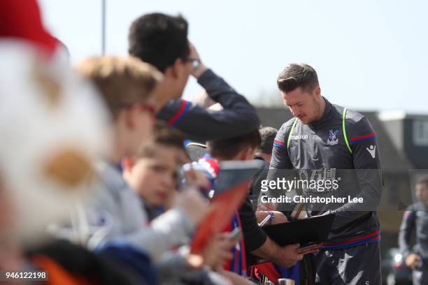 Wayne Hennessey of Crystal Palace signs autographs as he arrives at the stadium prior to the Premier League match between Crystal Palace and Brighton...